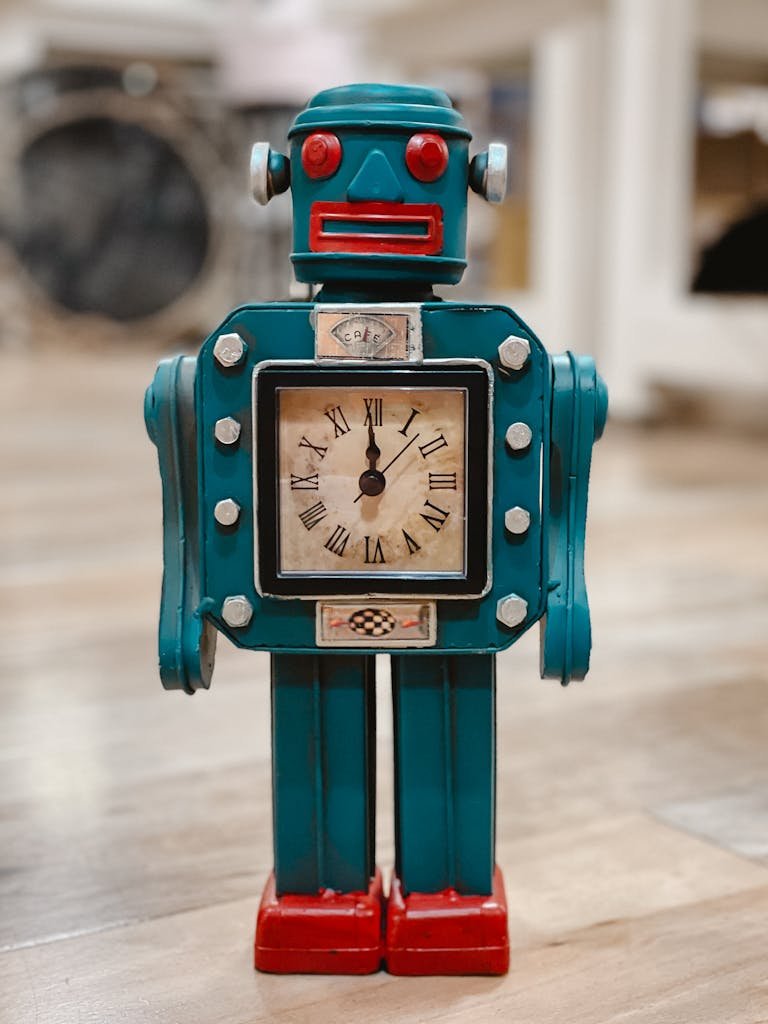 Vintage robot-shaped clock with roman numerals on a wooden floor inside a room.